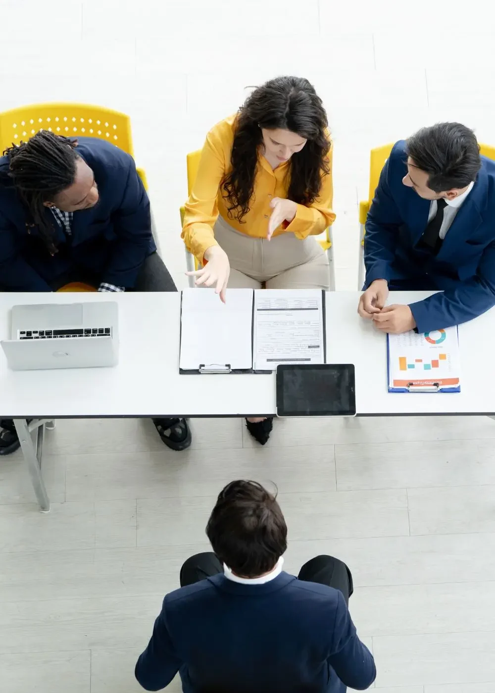 HR team meeting discussing strategic employee management in a modern office environment.